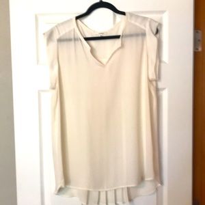 Cream colored sleeveless blouse